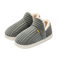 Pair of gray slippers with white soles on a white background