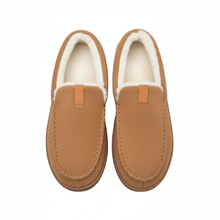 Pair of brown slippers with white fur lining on a wooden floor.