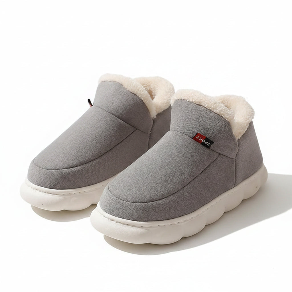 Gray slippers with white fur lining on a beige background