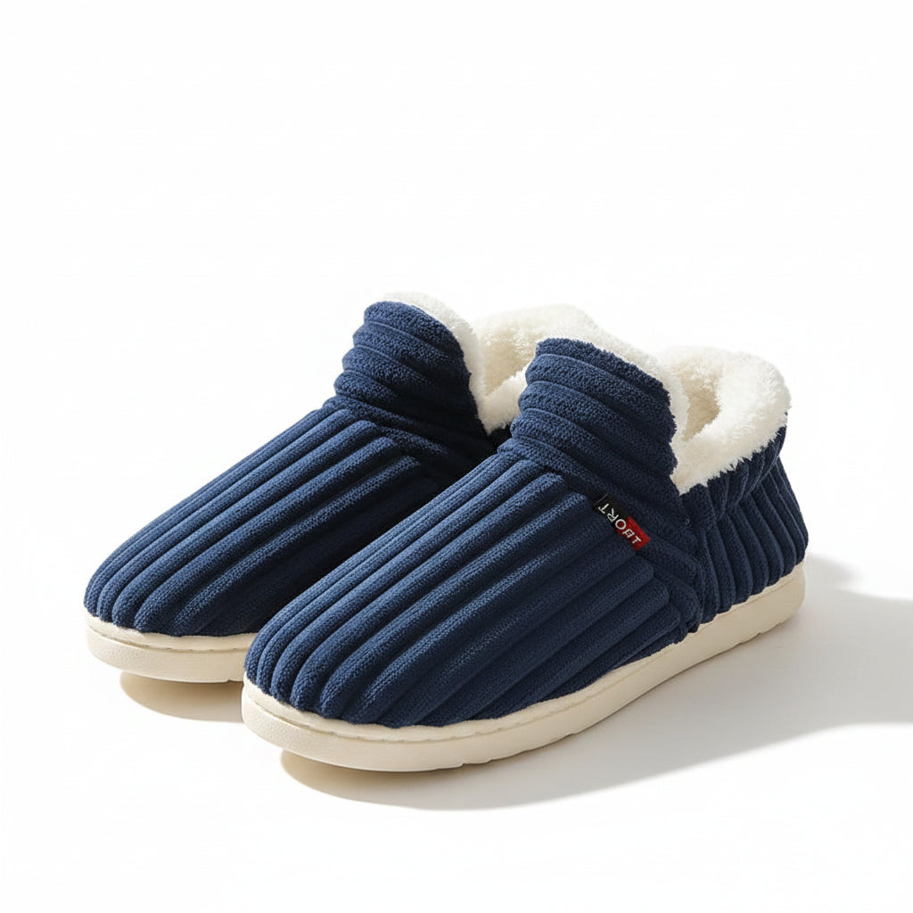 Blue slippers with white fur lining on a light-colored surface