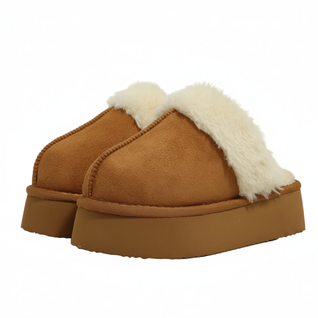 Brown slippers with white fur lining on a light gray background