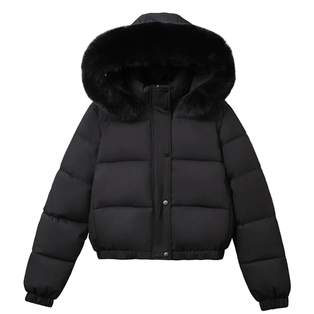 A black puffer jacket with a large black fur-trimmed hood, hanging on a wooden hanger against a light gray wall.