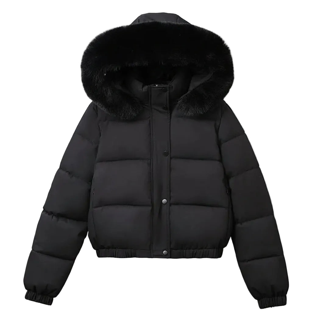 A black puffer jacket with a large black fur-trimmed hood, hanging on a wooden hanger against a light gray wall.