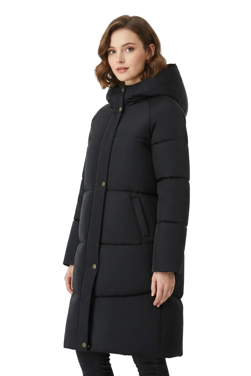 A woman modeling a long black puffer coat with a hood and gold-tone snap buttons, photographed against a plain white studio background.