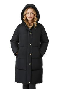 A woman wearing a long black hooded puffer coat with gold-tone snap buttons, photographed against a plain white studio background.