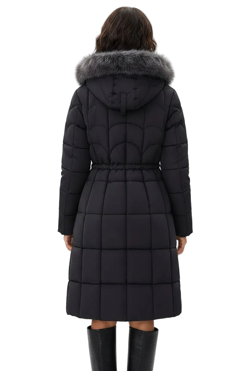 A model viewed from the back wearing a long black quilted puffer coat with a gray faux-fur trimmed hood and a matching tie detail at the back of the hood, paired with black knee-high boots against a plain white studio background.