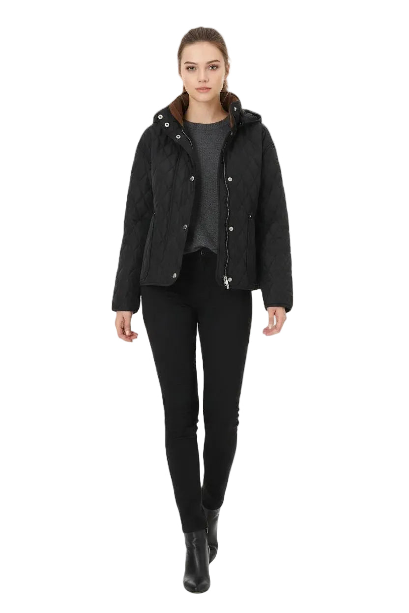 A woman modeling a black quilted jacket with a brown hood lining, worn over a dark gray top and black pants, against a plain white background.