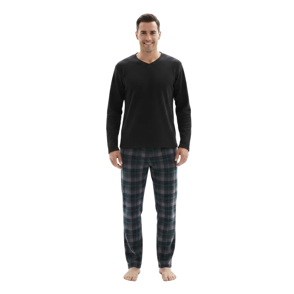 A man modeling a black long-sleeve V-neck shirt with dark green and black plaid pajama pants, standing against a plain white background.