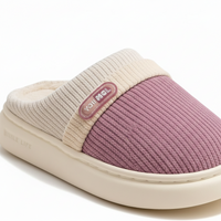 A single ribbed slip-on mule slipper in cream and dusty pink, shown on a clean white background. The brand name 'YOU ME!L' is visible on a small pink badge on the strap.