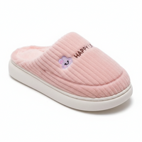 A single pink ribbed fleece slipper with a white sole, featuring a small embroidered purple cloud character and the text 'HAPPY' on the side, set against a plain white background.