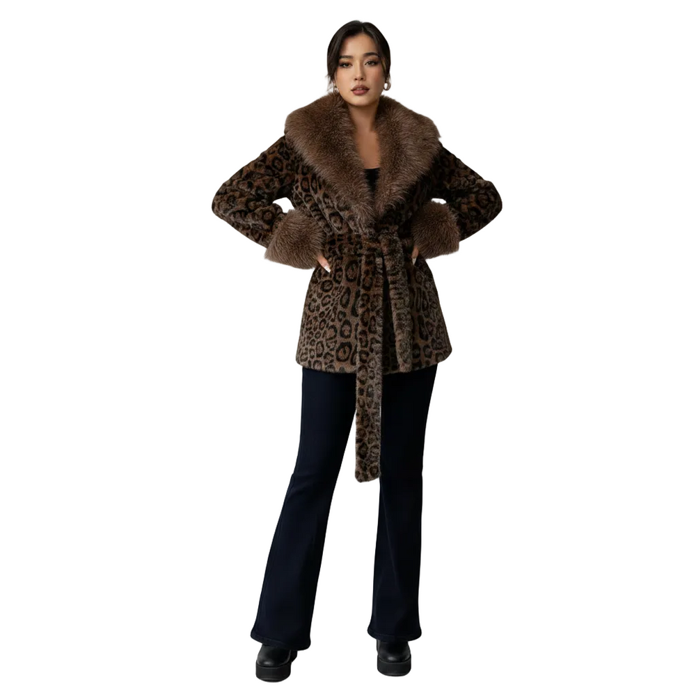 A woman modeling a leopard-print wrap coat with a brown faux-fur collar and cuffs, paired with dark navy flared pants and black shoes, against a plain white background.