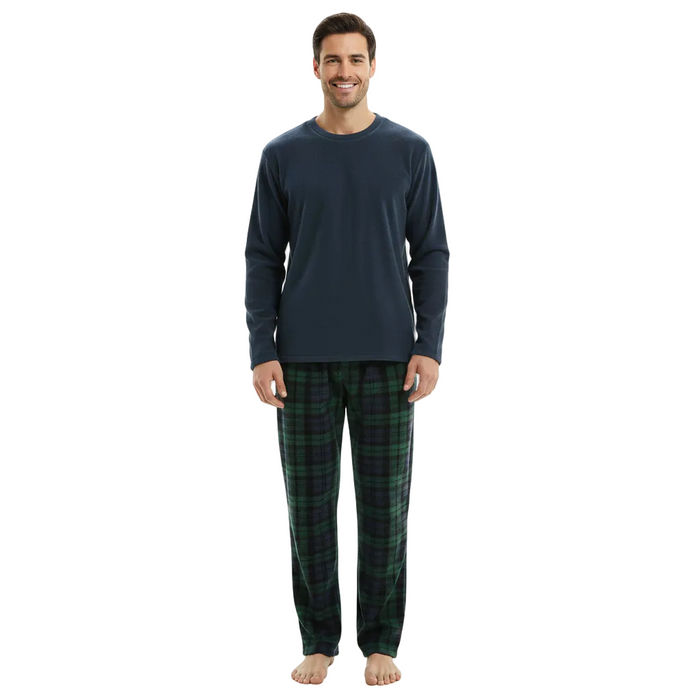 A man modeling a two-piece pajama set consisting of a dark navy long-sleeve shirt and green plaid pants, standing against a plain white background.
