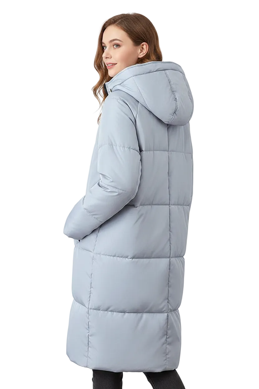 A woman wearing a long, light blue-gray hooded puffer coat, shown from a side-back angle against a plain white studio background.