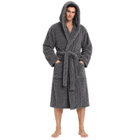 A man wearing a dark gray cable-knit hooded bathrobe with a tie belt and front pockets, standing against a plain white background.