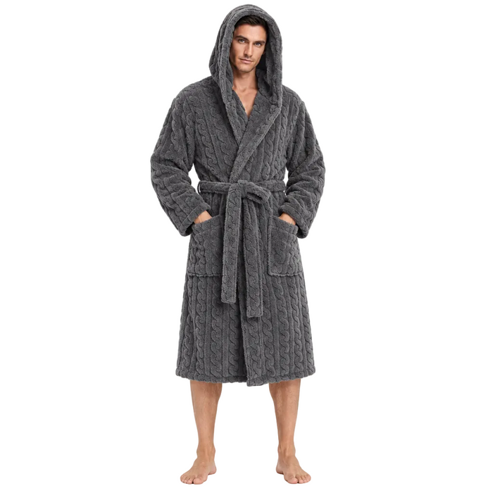 A man wearing a dark gray cable-knit hooded bathrobe with a tie belt and front pockets, standing against a plain white background.