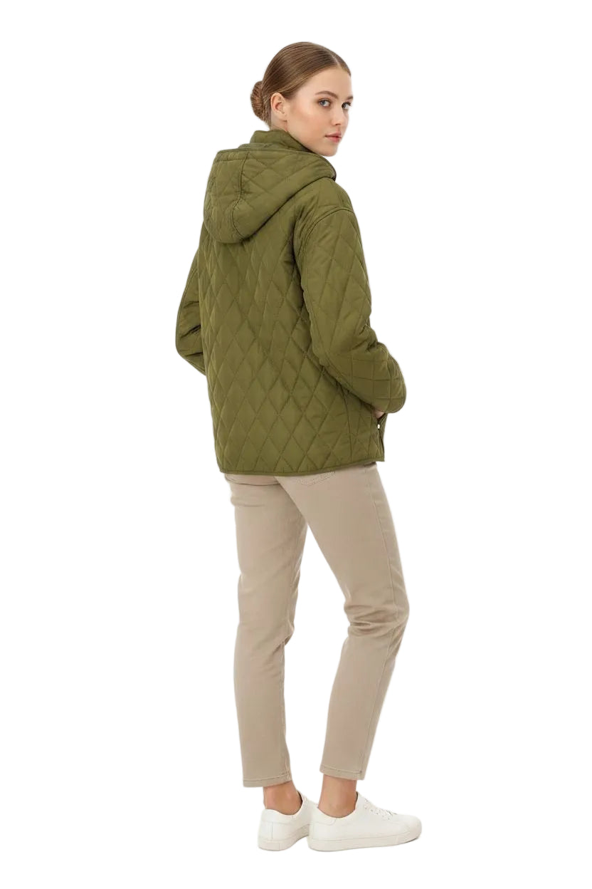 A woman wearing an olive green quilted hooded jacket, beige pants, and white sneakers, shown from a side-back angle against a plain white background.