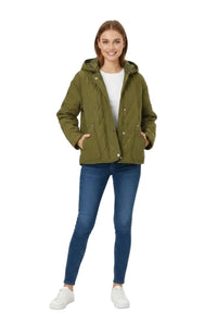 A woman modeling an olive green quilted hooded jacket, paired with a white t-shirt, blue skinny jeans, and white sneakers, against a solid white background.