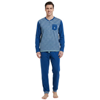 A man modeling a two-piece pajama set consisting of a long-sleeve henley shirt with blue and white horizontal stripes and solid blue sleeves, paired with solid blue pants, against a plain white background.