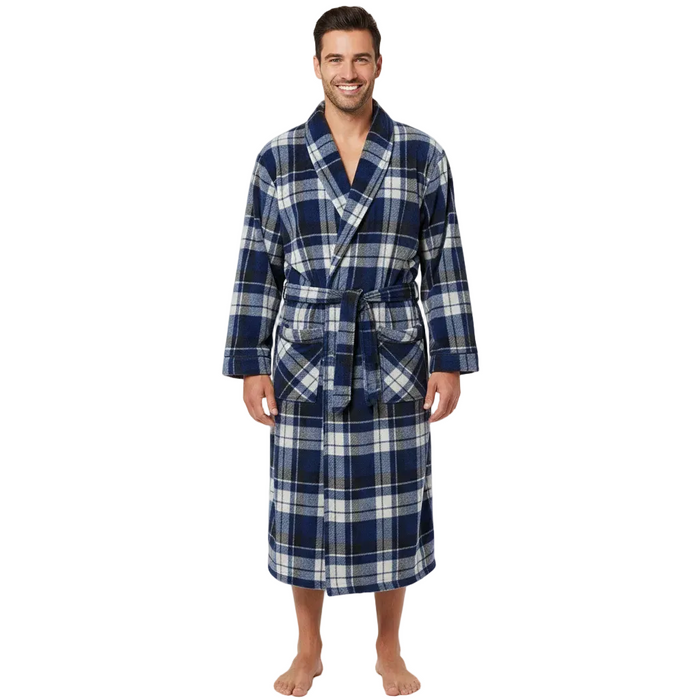 A man wearing a navy blue and white plaid bathrobe, standing barefoot against a light gray studio background.