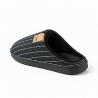 A single slip-on mule slipper shown from a three-quarters angle on a white background. The slipper features a dark gray and black pinstripe fabric upper, a black sole, and a soft black fleece interior.