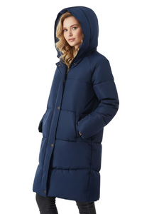 A woman wearing a long navy blue hooded puffer coat with horizontal quilting, shown from the waist up against a plain white studio background.