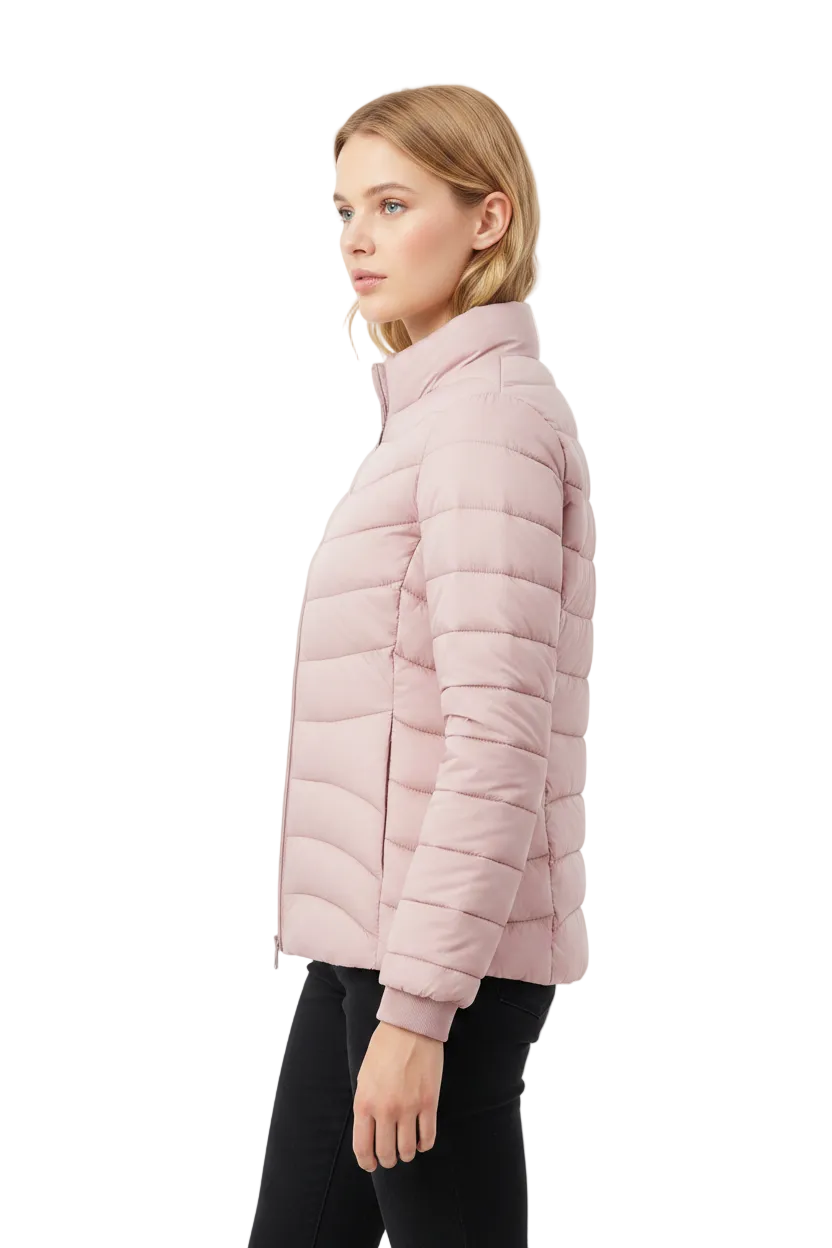 A woman shown in side profile wearing a light pink puffer jacket and black pants against a plain light gray studio background.