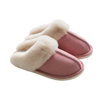 A pair of pink slip-on house slippers with thick cream faux-fur trim, photographed on a clean white background.