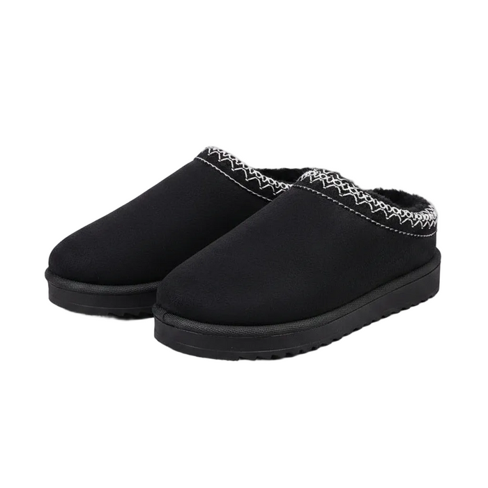 A pair of black slip-on winter slippers with a white zigzag patterned trim along the top edge, shown on a clean white background.