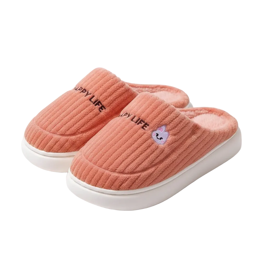 A pair of ribbed knit slip-on slippers in a dusty coral pink color, featuring black embroidered 'LUPY LIFE' text and a small purple cartoon bunny logo on the side, with white soles.