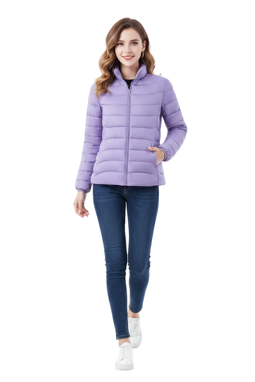A woman modeling a light purple puffer jacket, paired with dark blue skinny jeans and white sneakers, against a solid white background.