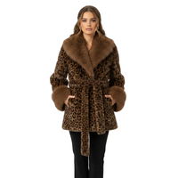 A woman modeling a brown leopard-print faux fur coat with a large brown fur collar, belt, and cuffs, paired with black pants, against a plain white studio background.
