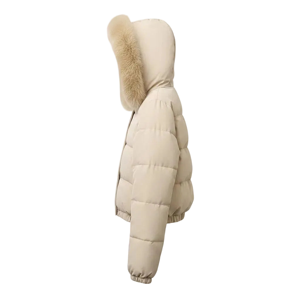 A side profile view of a beige puffer jacket featuring a large hood with fluffy beige faux-fur trim, set against a plain white background.