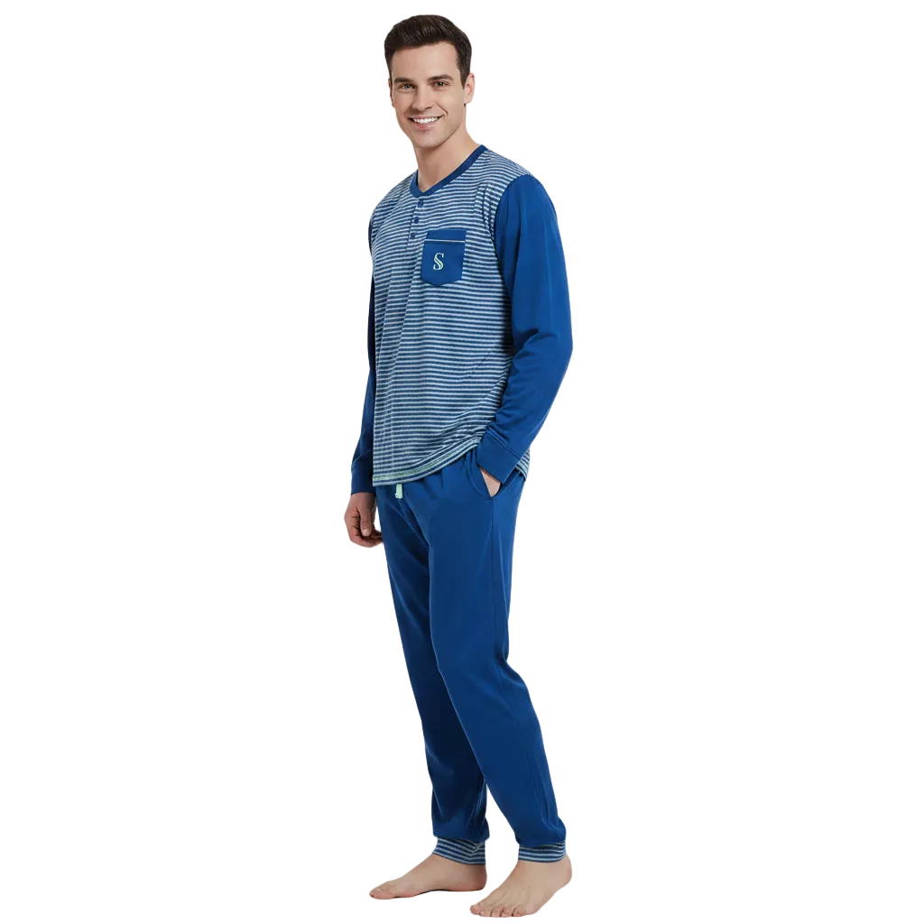 A man modeling a two-piece pajama set consisting of a long-sleeve henley shirt with a blue and white striped body and solid blue sleeves, paired with matching solid blue pants.