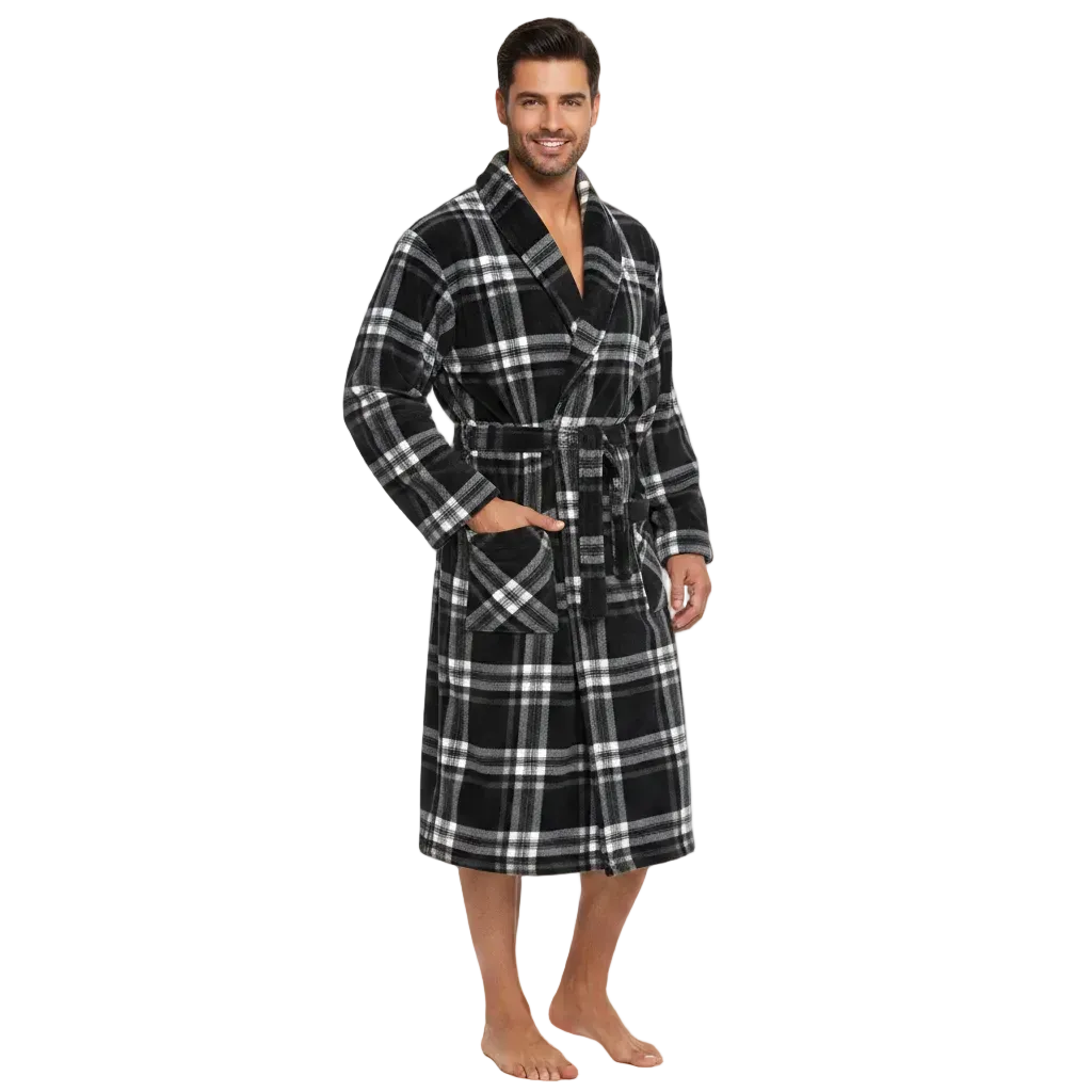 A man modeling a plush black and white plaid bathrobe against a solid white background.