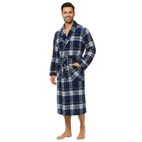 A man wearing a blue, white, and gray plaid bathrobe, standing against a solid white background.