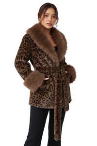 A woman modeling a brown leopard-print faux fur coat with a matching faux fur collar, cuffs, and belt, paired with black pants against a light gray studio background.