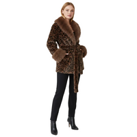 A model wearing a brown leopard-print coat with a thick brown fur collar and belt, paired with black pants and black ankle boots, against a light gray studio background.