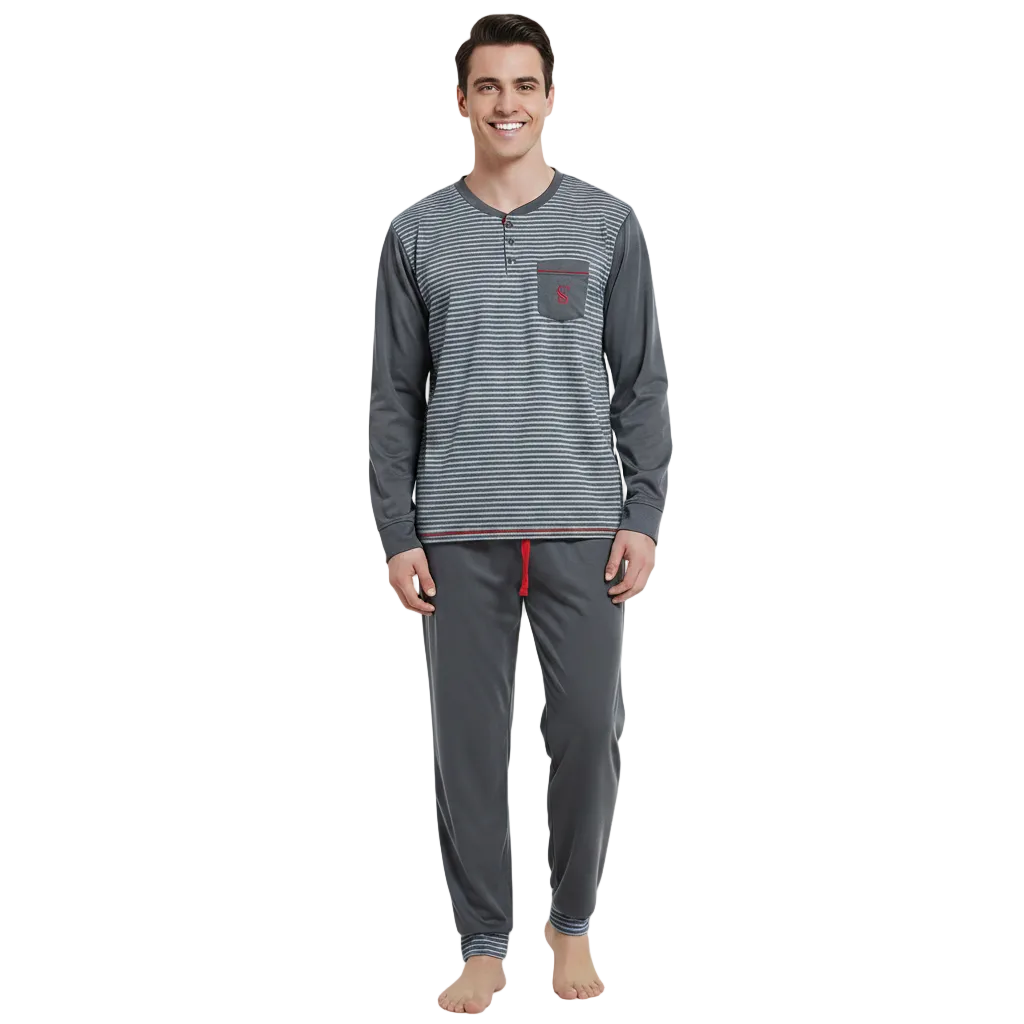 A man modeling a two-piece long-sleeve pajama set consisting of a gray and white striped henley shirt with a chest pocket and matching gray jogger pants with a red drawstring, shot against a solid white background.