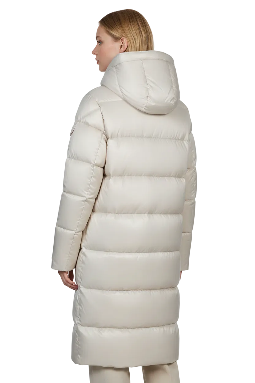 A woman shown from the back wearing a long, puffer-style hooded coat in a warm off-white or cream color, photographed against a plain white studio background.